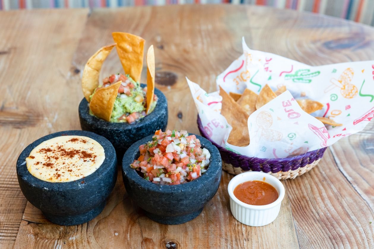 Mexican starters with guacamole, salsa and queso served with tortilla chips